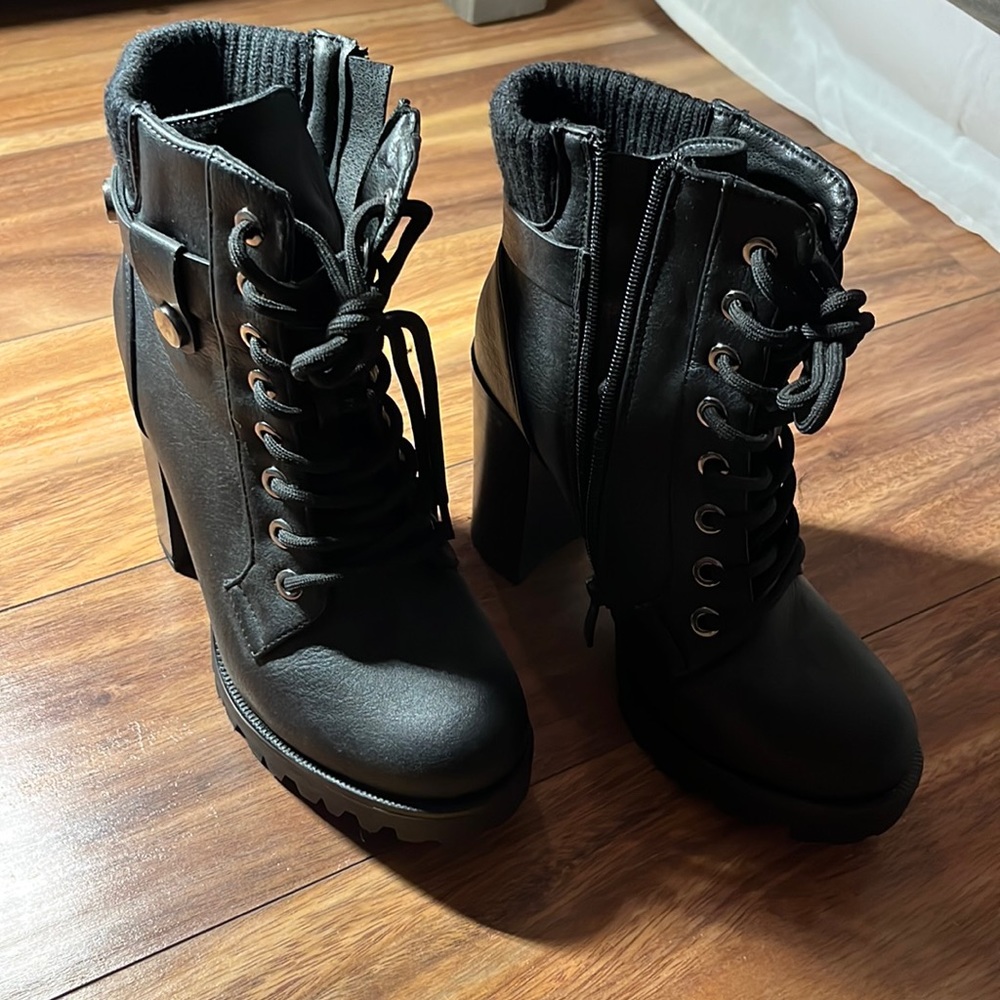 Black leather healed combat boots